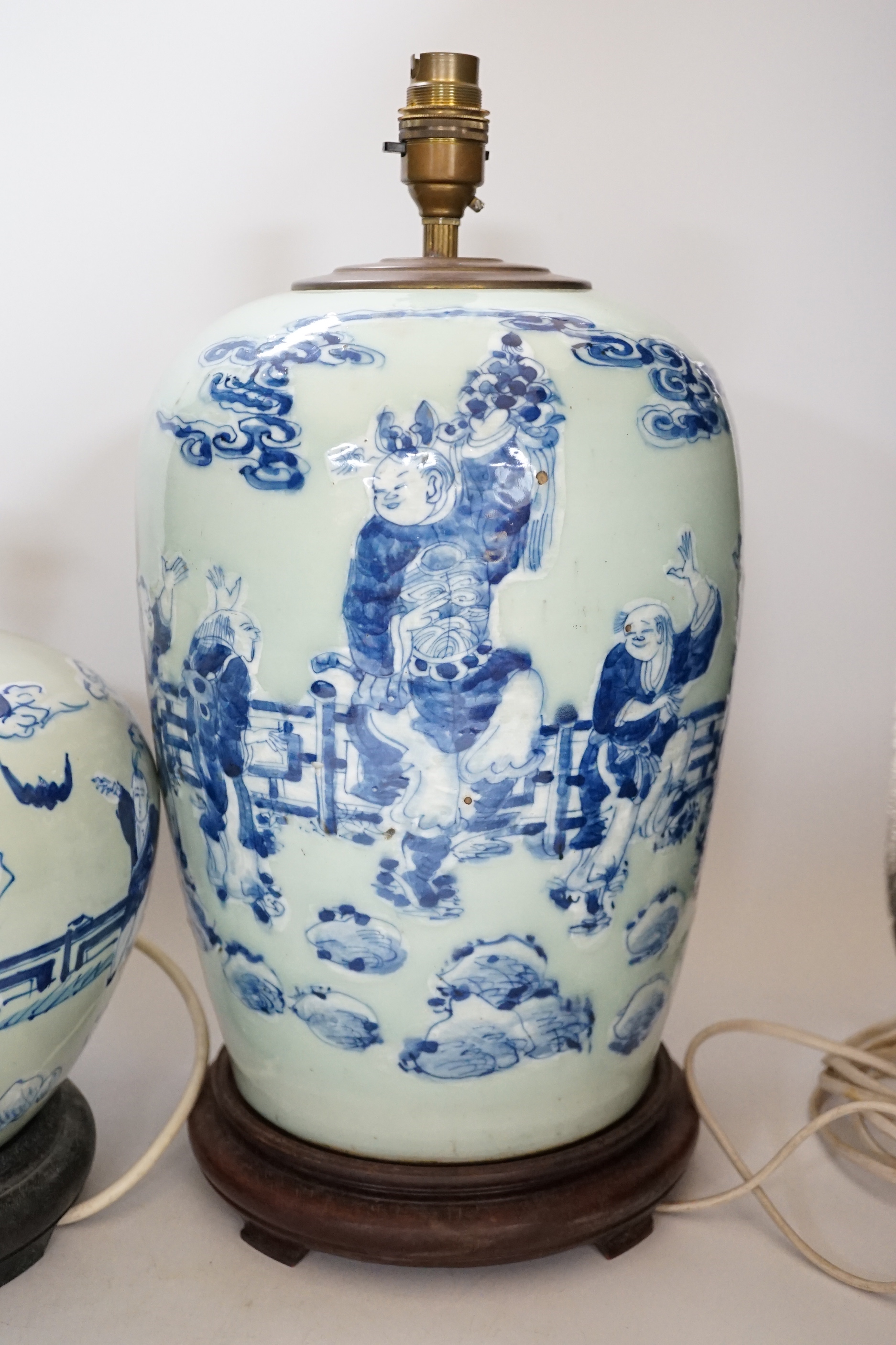 Two Chinese blue and white celadon glazed lamp bases, largest 43cm high including fitting